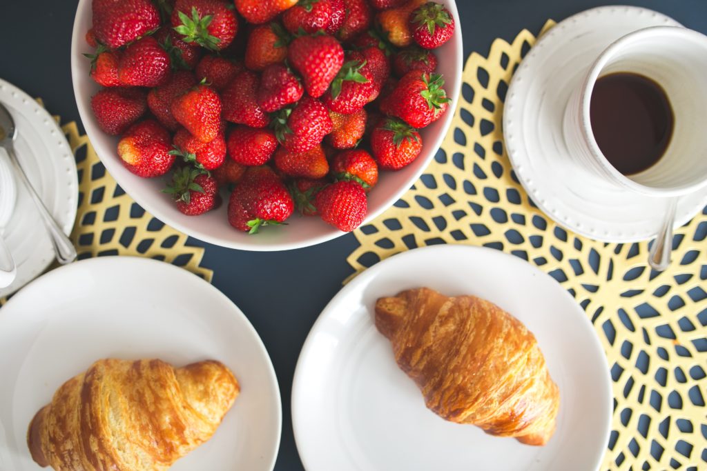 French Croissant with strawberries and coffee
