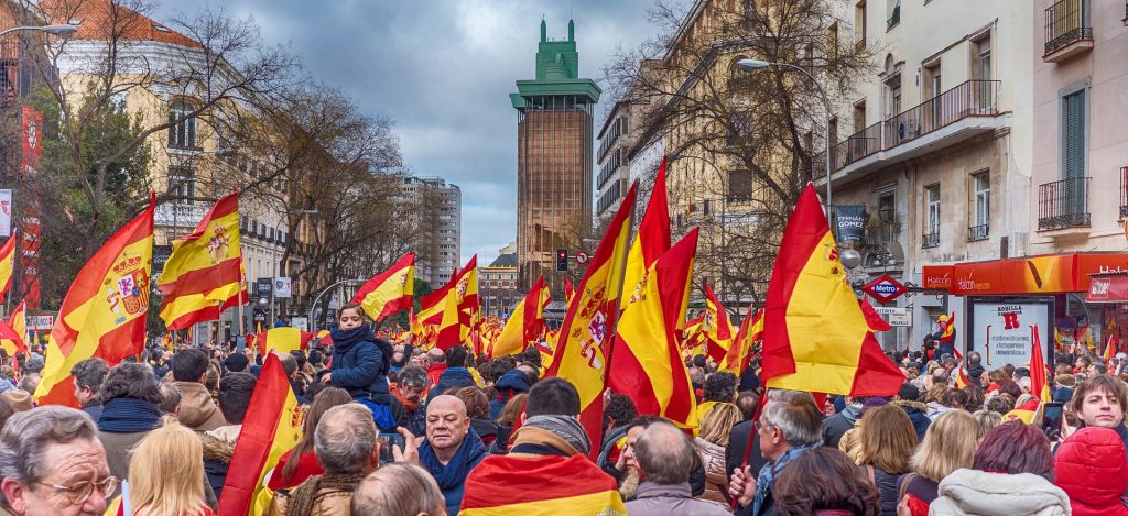 Spaniards Holding Spanish Flags